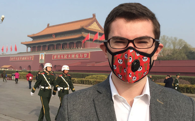 Chris Dobbing, CEO of Cambridge Mask wears a mask in Beijing, China